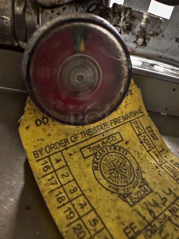 Kitchen One AD-576822 fire extinguisher, outstanding condition, Class K, tested and working, includes state fire marshal inspection tag.