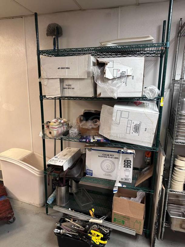 Commercial green epoxy coated wire storage rack loaded with assorted boxes and kitchen items. Excellent condition, tested.