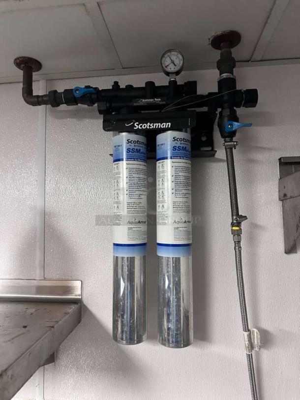 Scotsman SSM Plus AquaArmor commercial water filtration system in excellent condition, wall-mounted. Includes visible gauges and pipes.