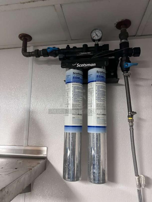 Scotsman SSM Plus AquaArmor commercial water filtration system installed, excellent condition, with gauge and clear filter housings.