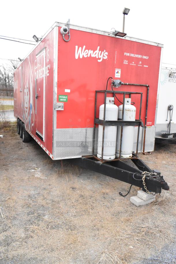 28' Wendy's fast food trailer with commercial-grade kitchen equipment. Features include CaptiveAire hood and Taylor grill.