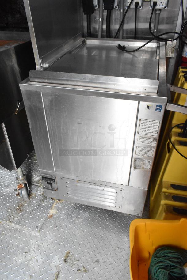 Commercial-grade stainless steel cooler with NSF label on the door, suitable for fast food trailer use.