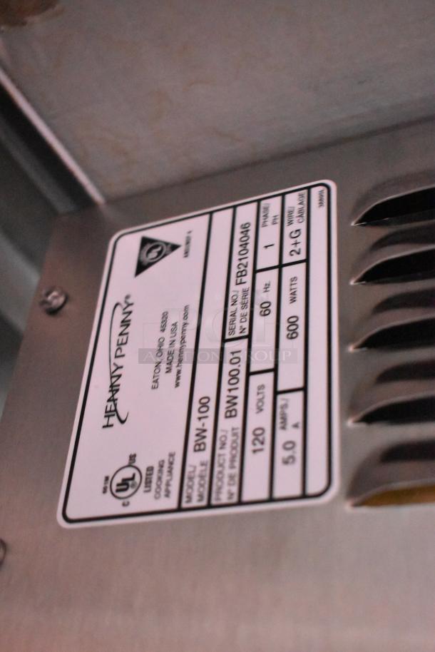 Henny Penny appliance label showing model BW-100, serial number FB210406, 120 volts, 600 watts, UL listed. Made in USA.
