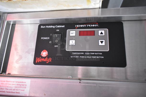 Henny Penny bun holding cabinet with Wendy's branding, temperature control panel featuring easy set buttons.