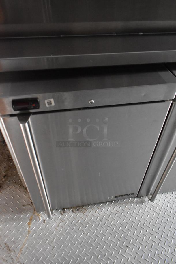 Stainless steel Hoshizaki refrigeration unit in Wendy's mobile kitchen, showing a diamond plate floor.