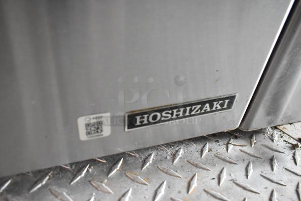 Hoshizaki cooler label on diamond plate flooring, featuring an adjacent QR code sticker.
