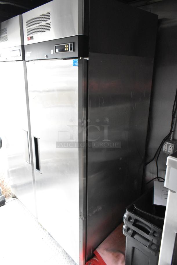 Stainless steel Liebherr cooler inside a 28' Wendy’s fast food trailer. Commercial kitchen equipment.