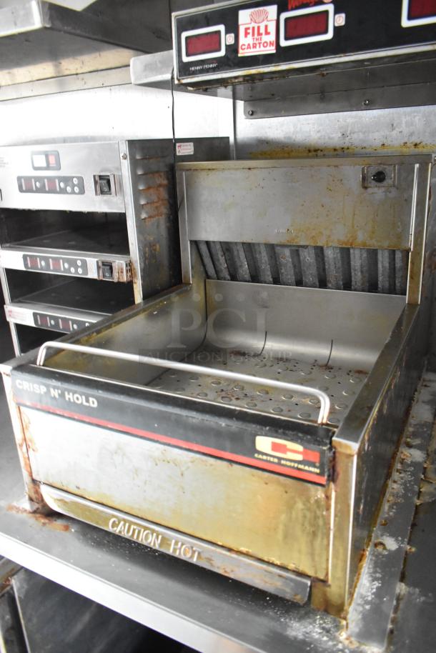 Carter-Hoffmann Crisp N' Hold unit in used condition, featuring stainless steel design with visible wear and "Caution Hot" label.