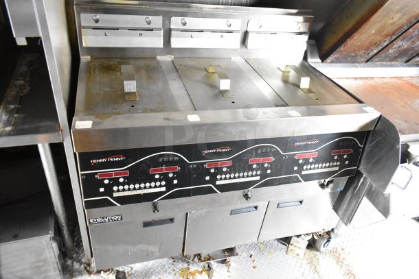 Henny Penny Evolution Elite fryer in fast food trailer, featuring digital controls and stainless steel finish. Clean condition.
