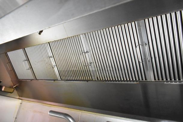 Stainless steel CaptiveAire grease hood in a 28' Wendy's mobile kitchen trailer, new in 2021, for auction.