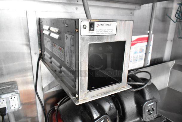 Henny Penny fryer in a Wendy's fast food trailer, stainless steel, shows power switch and safety labels, tested and working.