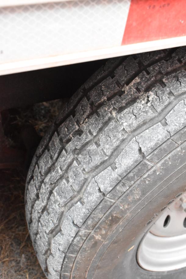 Tire of a 28' Wendy's fast food trailer, showing usage wear; suitable for mobile kitchen operations.