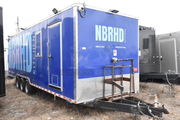 Blue Rock Solid Cargo 24' fast food trailer, fully equipped. Features NBRHD Kitchens branding and commercial-grade fixtures.