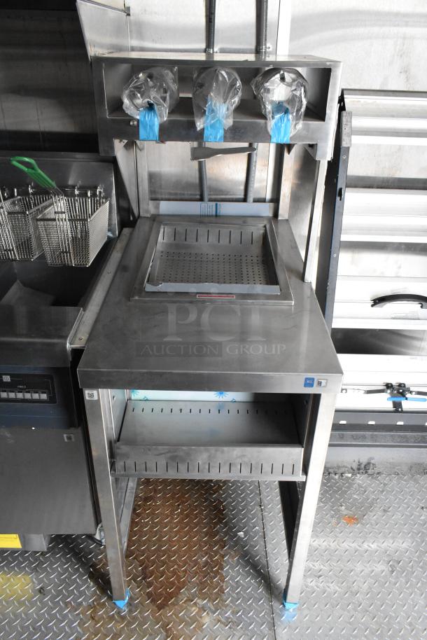 Rock Solid Cargo 24' mobile kitchen trailer interior, featuring commercial-grade fry station and equipment, new condition.