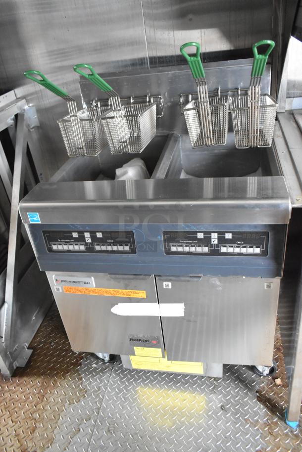 Rock Solid Cargo 24' fast food trailer featuring a Frymaster gas 2-bay fryer with dual baskets, in excellent condition.