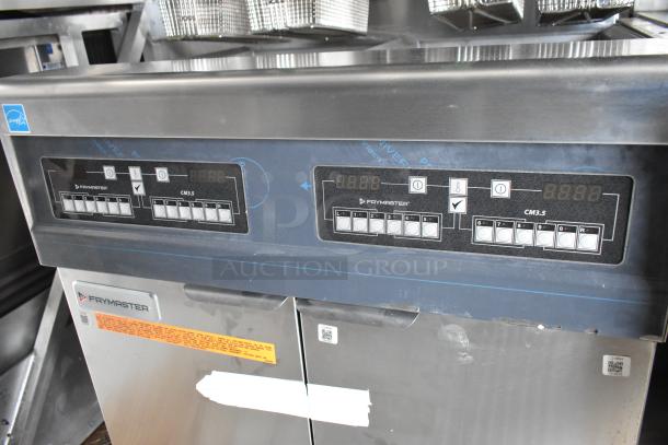 Rock Solid Cargo mobile kitchen showcasing Frymaster gas 2-bay fryer with digital controls and visible labels.