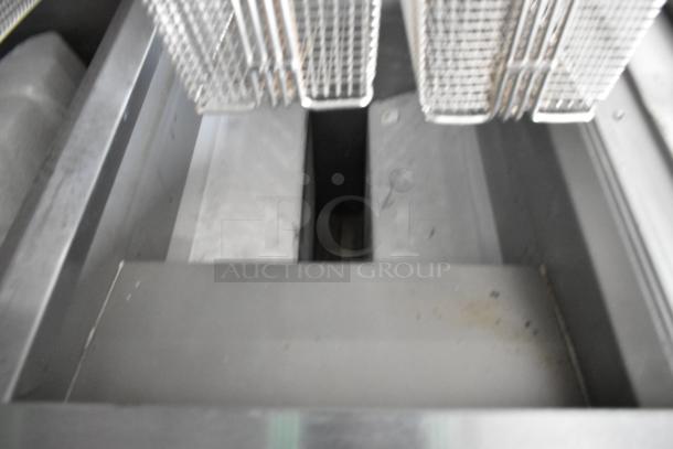 Rock Solid Cargo 24' mobile kitchen interior showing commercial-grade frying baskets in stainless steel fixture.