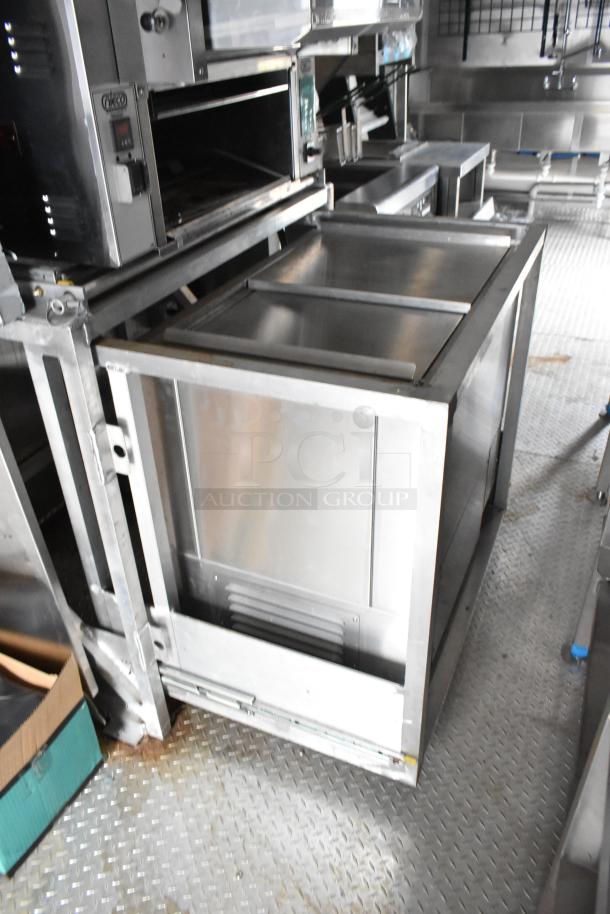 Rock Solid Cargo 24' mobile kitchen trailer, equipped with commercial-grade appliances including H&K freezer and Frymaster fryer.
