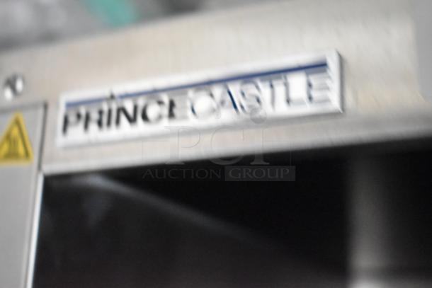 Close-up of a Prince Castle label on commercial-grade equipment, featured in a 24' Rock Solid Cargo mobile kitchen trailer.