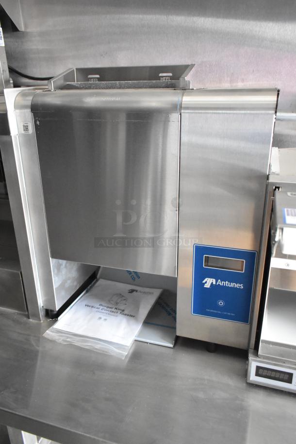 Antunes vertical contact toaster in new condition inside Rock Solid Cargo fast food trailer, labeled for Burger King use.