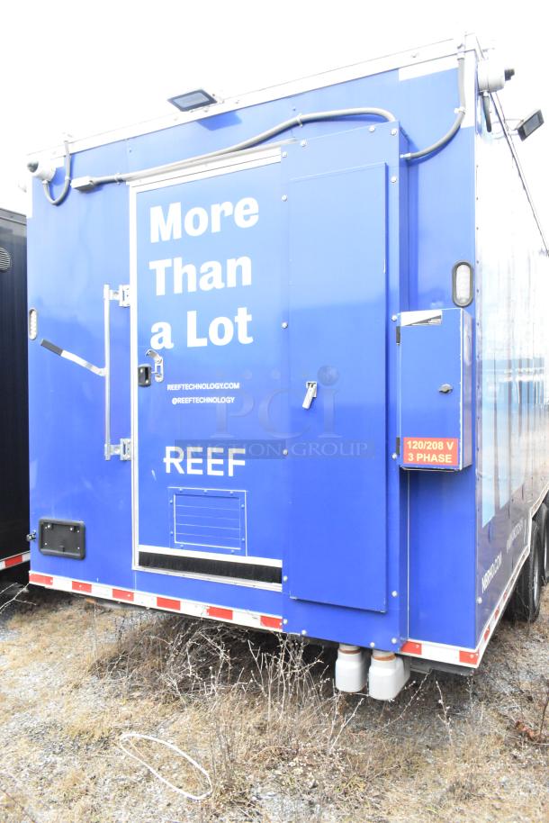 Rock Solid Cargo blue 24' fast food trailer, labeled "More Than a Lot" and "REEF", equipped for mobile kitchen use.