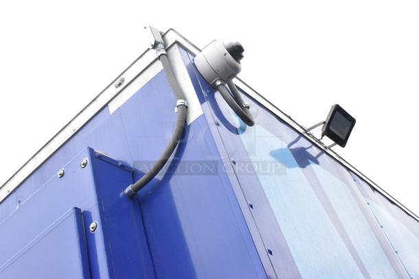 Blue Rock Solid Cargo 24' fast food trailer featuring external fixtures and cables.