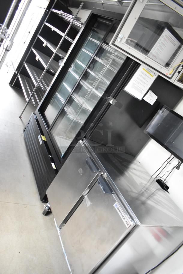 Fully equipped 24' Nationwide food trailer with Beverage Air coolers, shelving, and Gree AC. Ready for business.