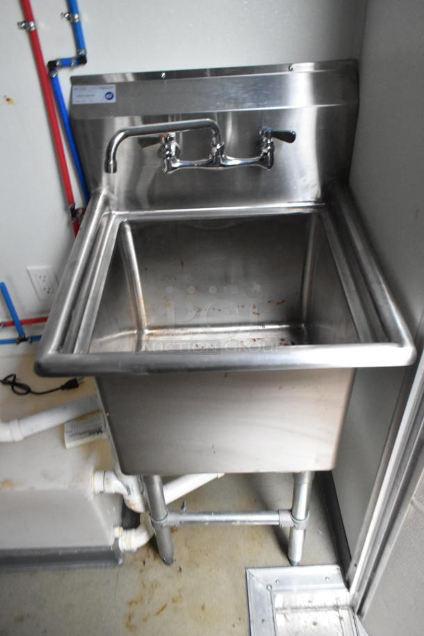 Stainless steel sink with wall-mounted faucet, part of Nationwide 24' food trailer, showing clean condition and secure plumbing.