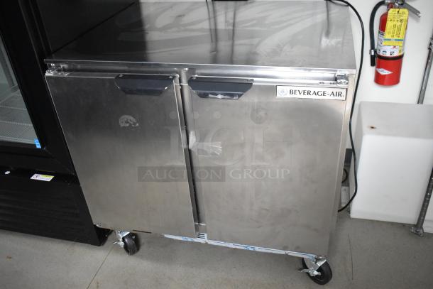 Beverage Air stainless steel two-door commercial cooler on wheels, part of a fully outfitted 24' food trailer.