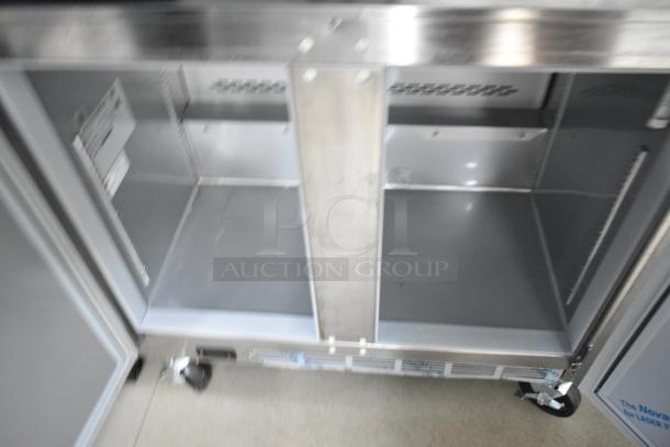 Interior view of Nationwide 24' food trailer showing empty stainless steel compartments, suitable for cooling equipment installation.