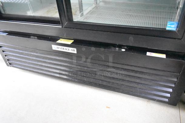 Beverage Air cooler in Nationwide food trailer. Black exterior, label visible, commercial-grade equipment, excellent condition.