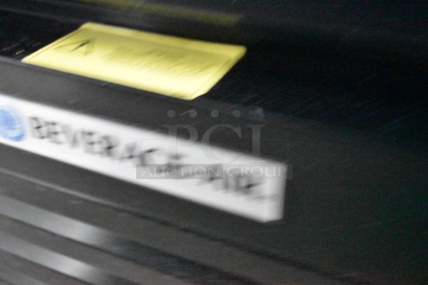 Blurry close-up showing a Beverage Air label on a piece of commercial equipment in a Nationwide 24' food trailer.