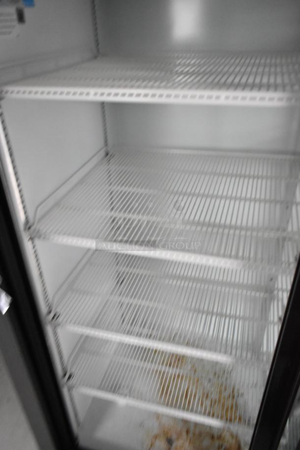 Interior view of a Beverage Air 2-door cooler with wire shelving inside a new Nationwide 24' mobile kitchen trailer.
