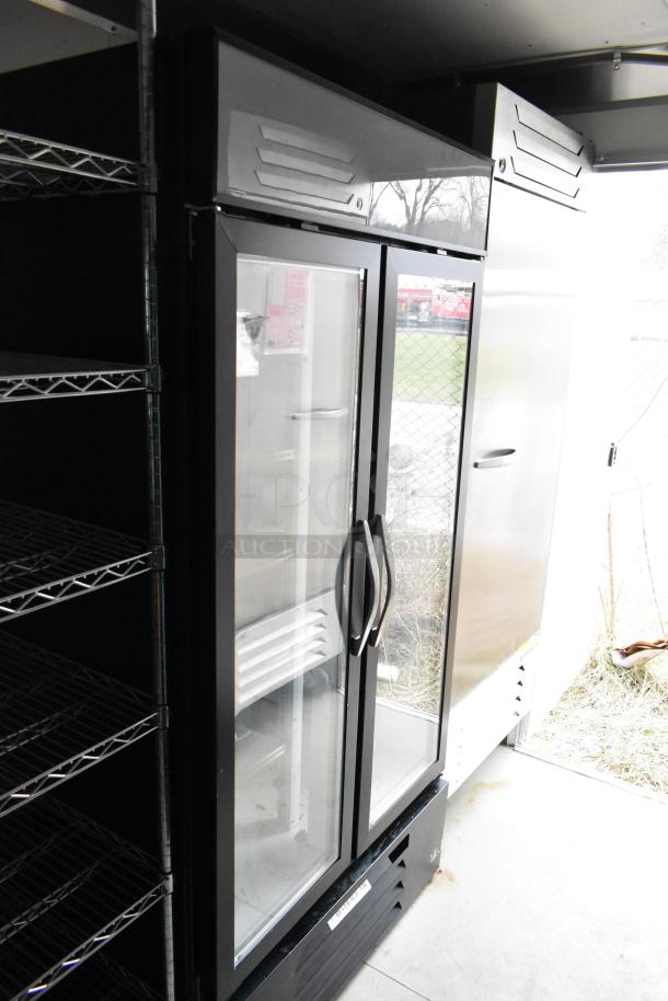 Nationwide 24' mobile kitchen interior with Beverage Air cooler, commercial shelves, and stainless steel appliances.