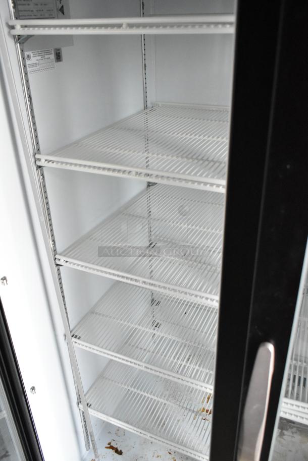 Interior of a Nationwide food trailer showing a Beverage Air two-door cooler merchandiser with white wire shelves and visible labeling.