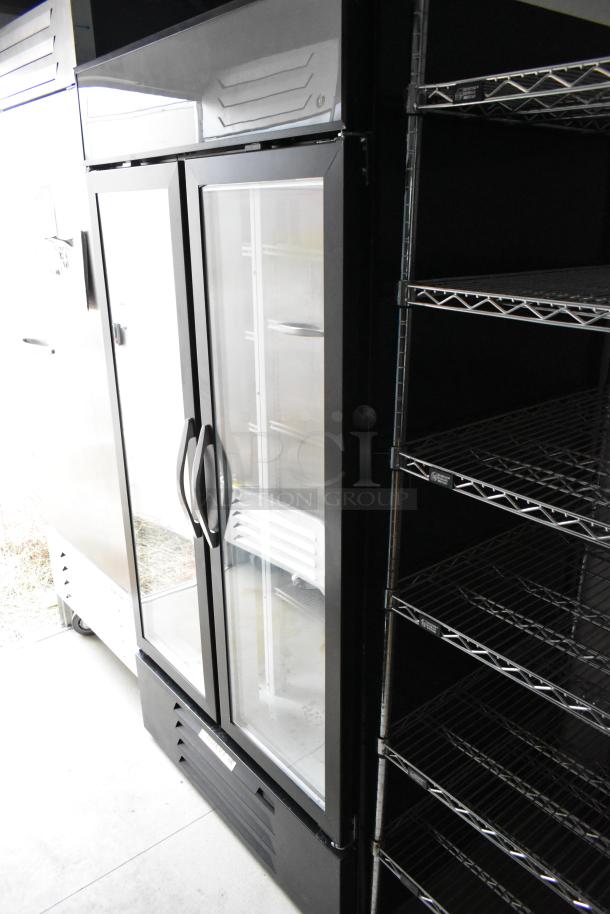 Nationwide 24' food trailer featuring Beverage Air 2-door cooler. Stainless steel finish, shelving, new condition. Perfect for a mobile kitchen setup.