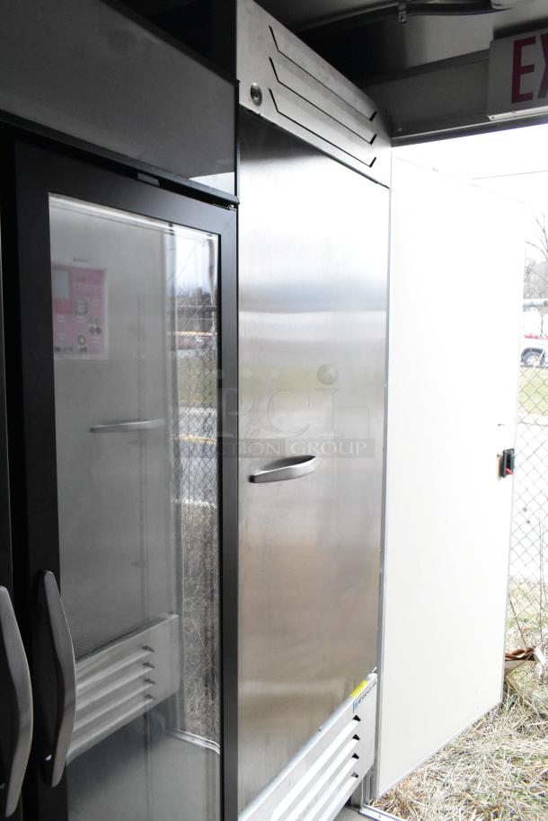 Nationwide 24' food trailer interior showing commercial-grade Beverage Air cooler. Stainless steel finish, pristine condition.