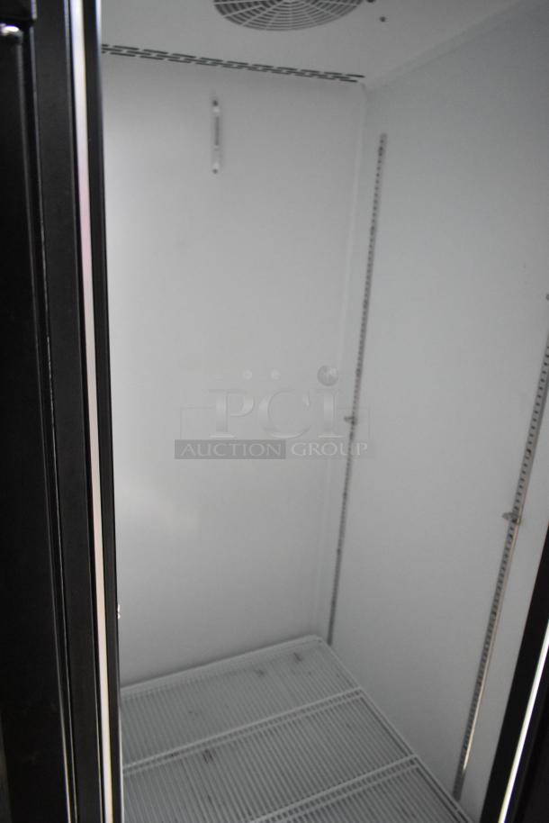 Interior view of a Beverage Air 2-door cooler merchandiser inside a 24' Nationwide food trailer, showing spacious shelving.