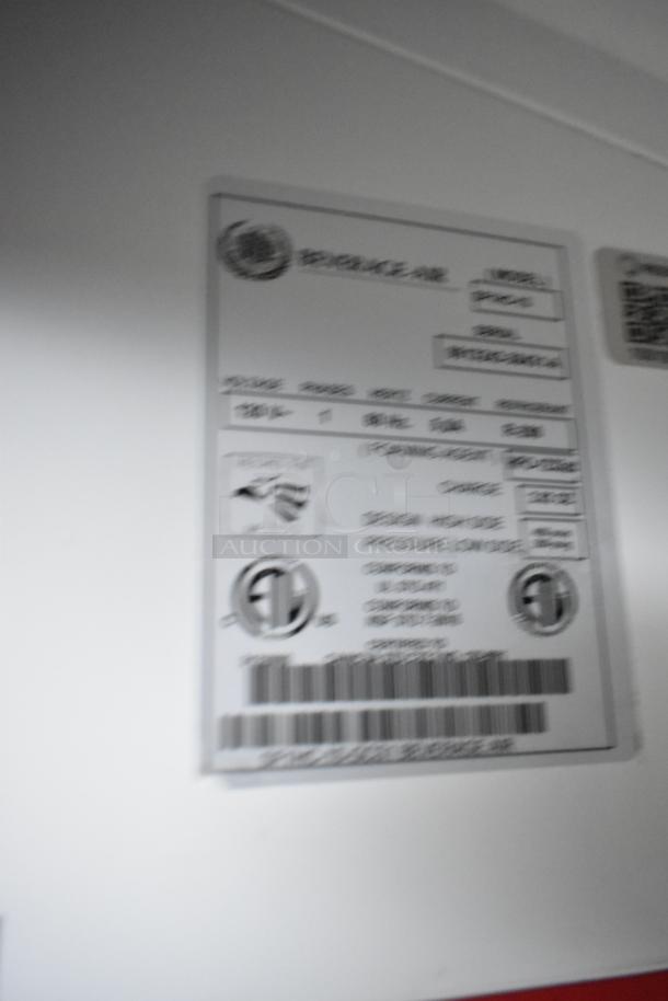 Blurred image of a Beverage Air appliance label on the Nationwide 24' food trailer, showing model and serial numbers.