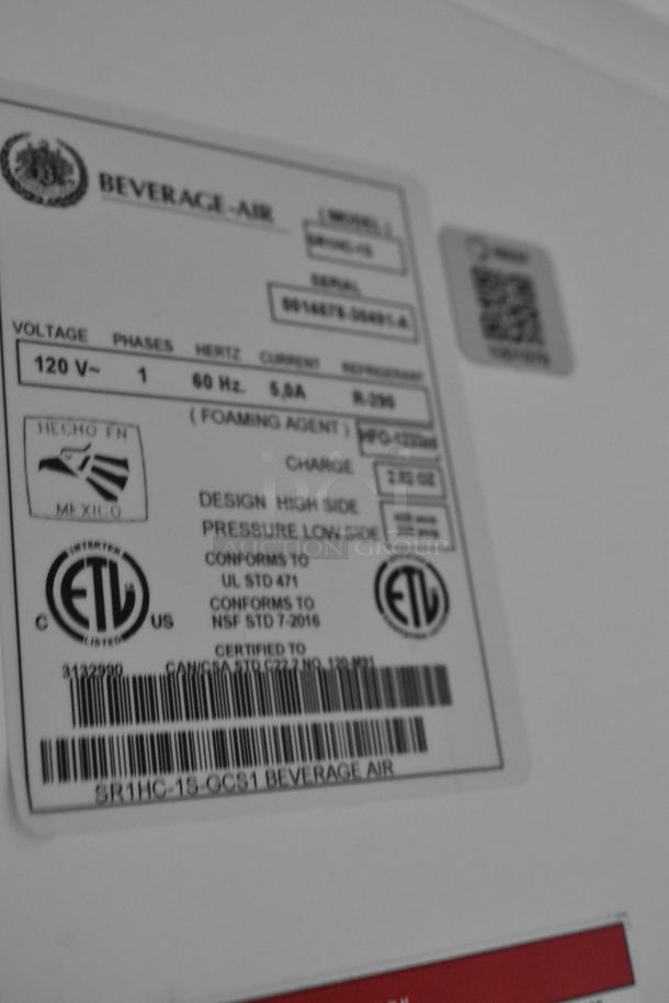 Label on Beverage Air cooler in a Nationwide food trailer, detailing voltage, model, certification, and compliance info.