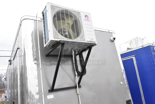 Nationwide 24' fully outfitted food trailer with Gree air conditioner mounted on exterior. Sold with a clear title.