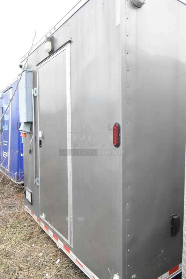 Nationwide 24' food trailer, gray exterior, equipped for commercial use. Features include air conditioning, coolers. New condition.