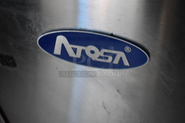 Close-up of Atosa logo on stainless steel surface, indicative of commercial equipment in a Stuff4less mobile kitchen trailer.