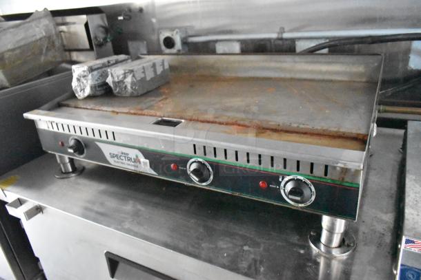 Winco Electric Flat Top Griddle on Stuff4less fast food trailer, featuring temperature knobs and durable stainless steel surface.