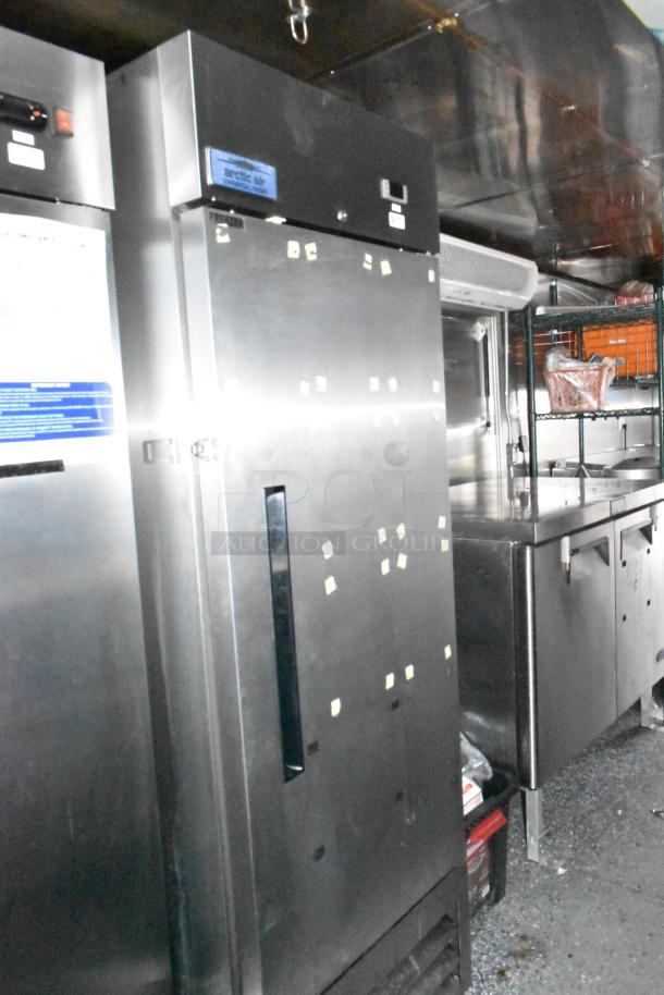 Stuff4less fast food trailer interior, featuring a stainless steel Arctic Air refrigerator, commercial-grade prep area, and storage.