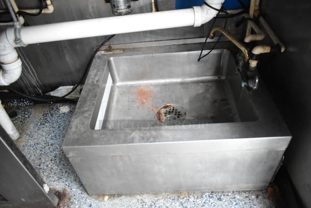 Stainless steel sink inside Stuff4less 24' mobile kitchen trailer, showing plumbing and fixtures, ready for equipment installation.