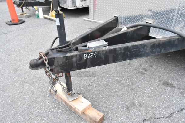 24' Stuff4less shell food trailer hitch with visible markings "13275." Ready for outfitting; includes sinks and AC.