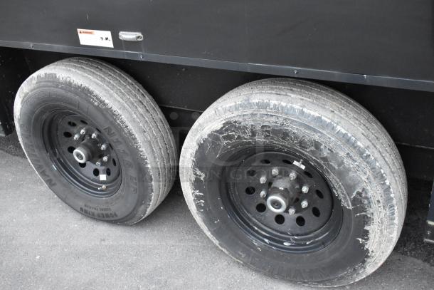 SDG 20' food trailer wheels, black rims, and tires. Trailer ready for outfitting, includes hand and mop sink, sold with clear title.
