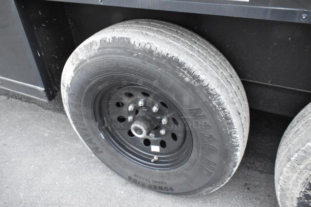 Close-up of SDG 20' food trailer tire with "N11.16 HD" marking. Durable design, ready for customization. Clear title.