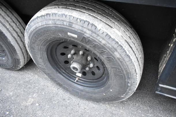 Close-up of a tire on the SDG 20' unbranded shell food trailer, showing tread and wheel details.
